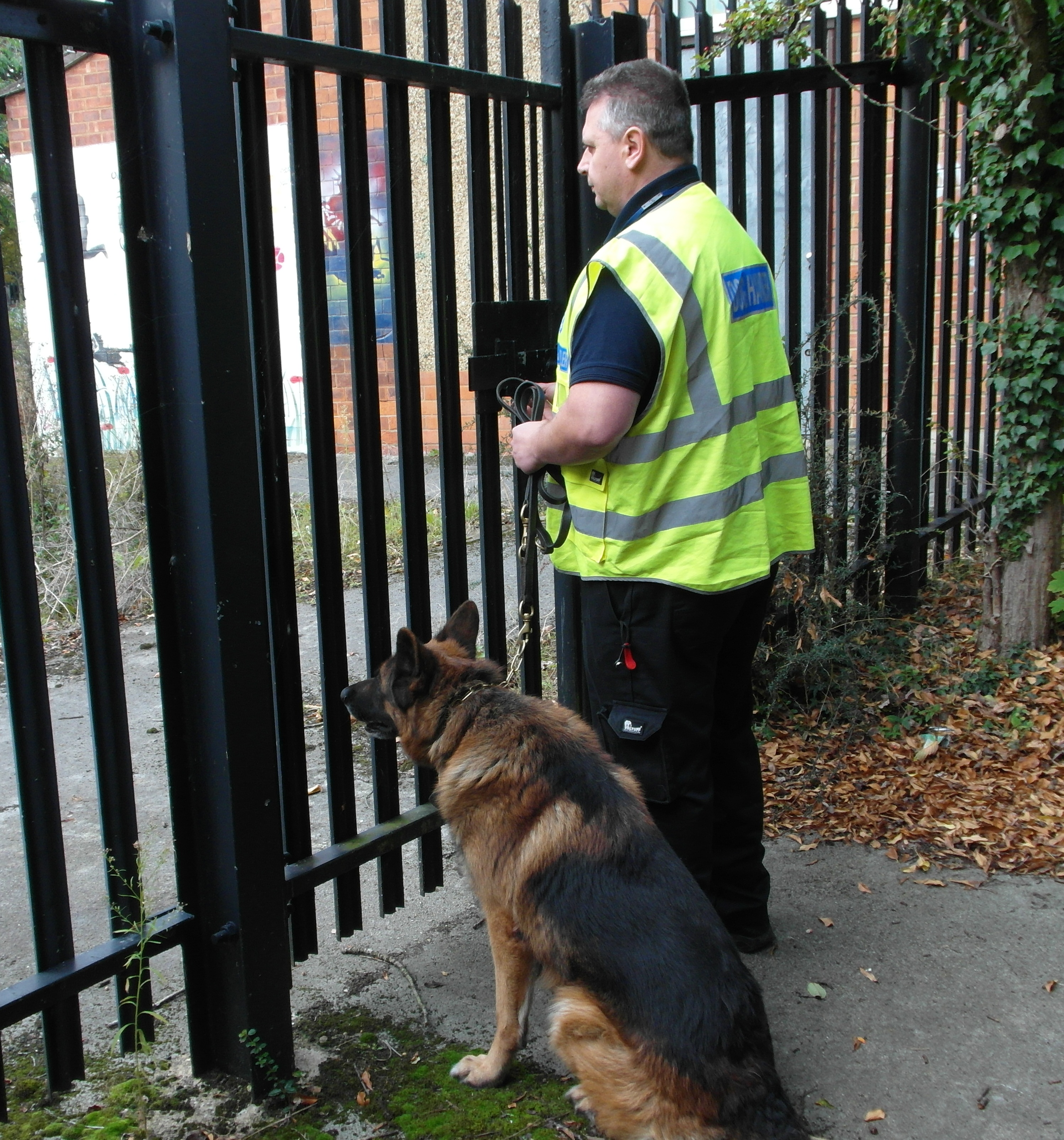 security guard and dog on patrol, one of our security services in Northamptonshire